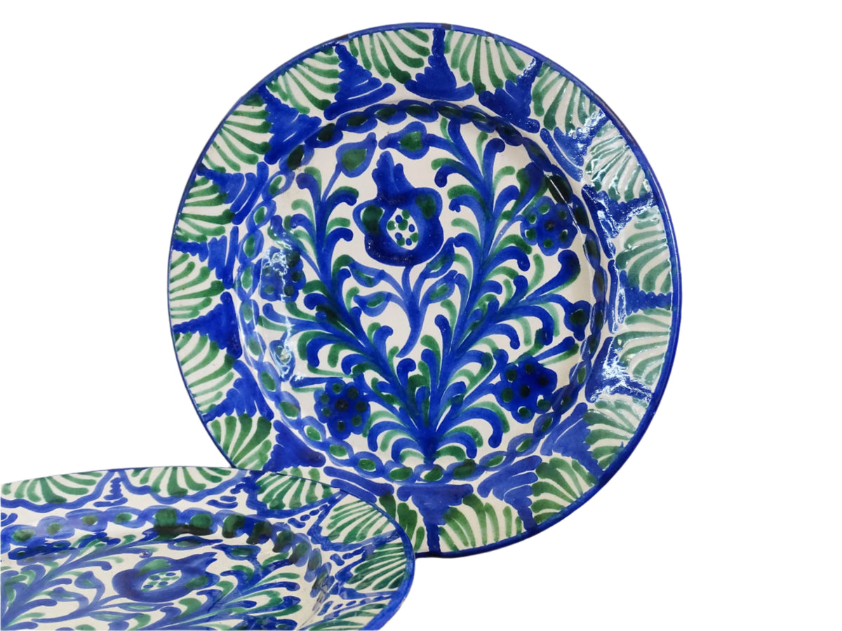 Pair of Spanish vintage Fajalauza plates, hand-painted in green and blue, decorated with flowers, leaves and pomegranates. Tin glazed terracotta plates for wall decor.