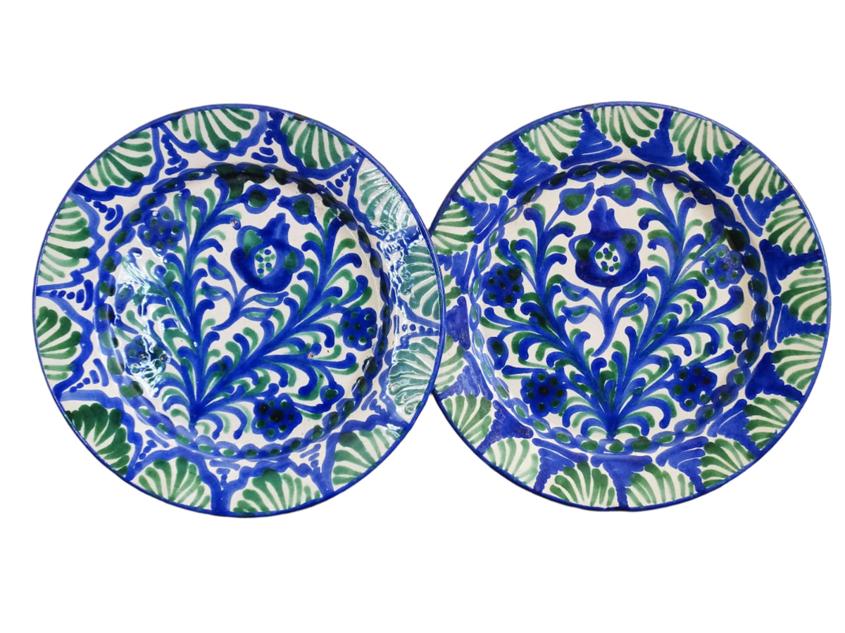 Pair of Spanish vintage Fajalauza plates, hand-painted in green and blue, decorated with flowers, leaves and pomegranates. Tin glazed terracotta plates for wall decor.