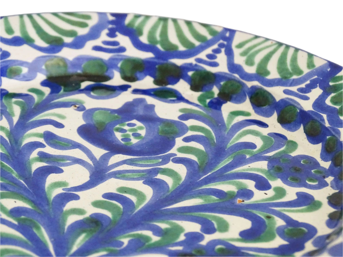 Pair of Spanish vintage Fajalauza plates, hand-painted in green and blue, decorated with flowers, leaves and pomegranates. Tin glazed terracotta plates for wall decor.