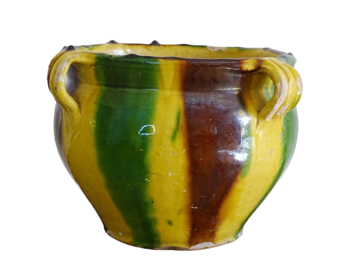 French antique ceramic planter from Castelnaudary. The pottery pot has a stripe drip glaze in yellow, green and brown. Antique cache pot in glazed terracotta.