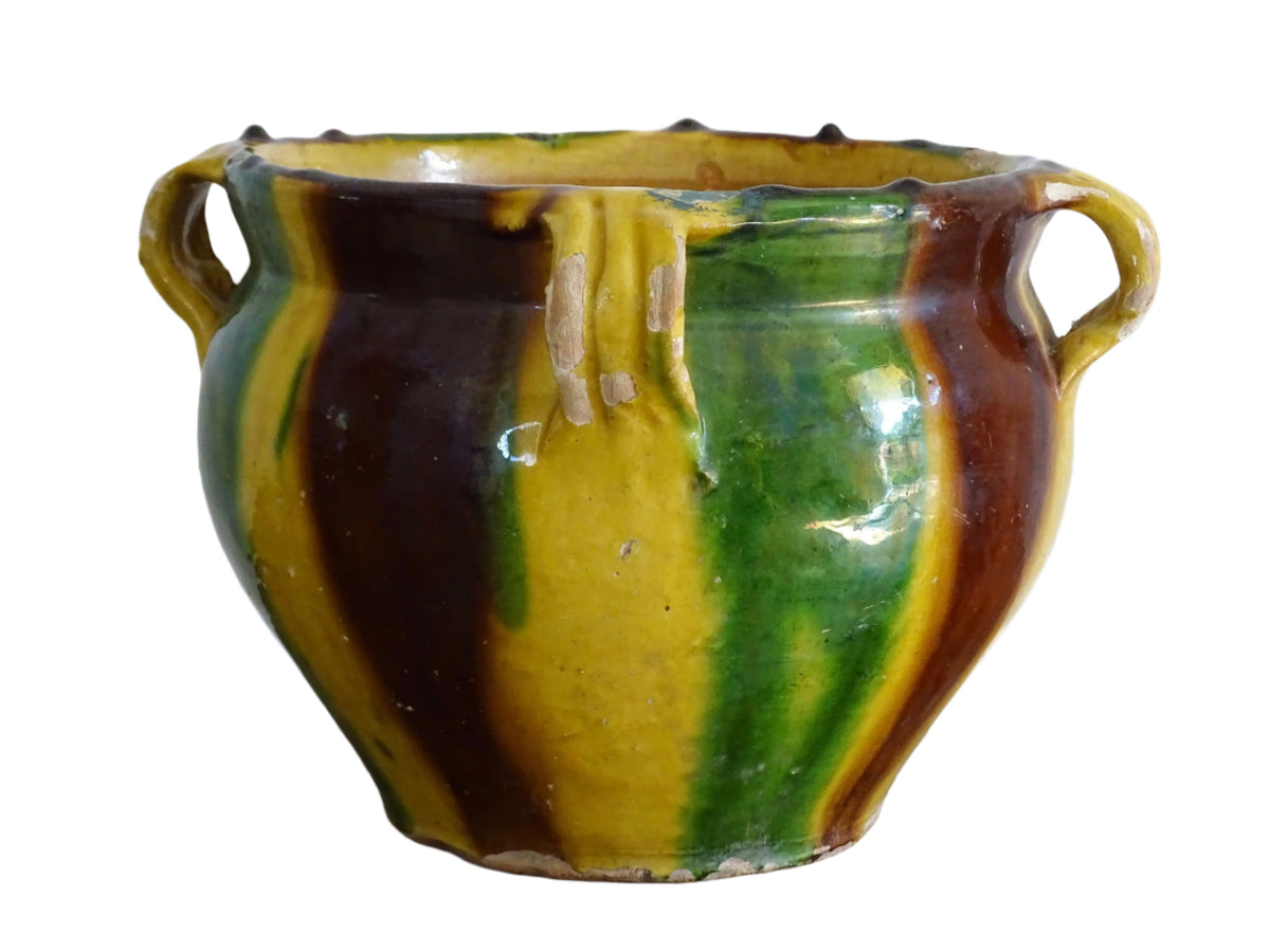 French antique ceramic planter from Castelnaudary. The pottery pot has a stripe drip glaze in yellow, green and brown. Antique cache pot in glazed terracotta.