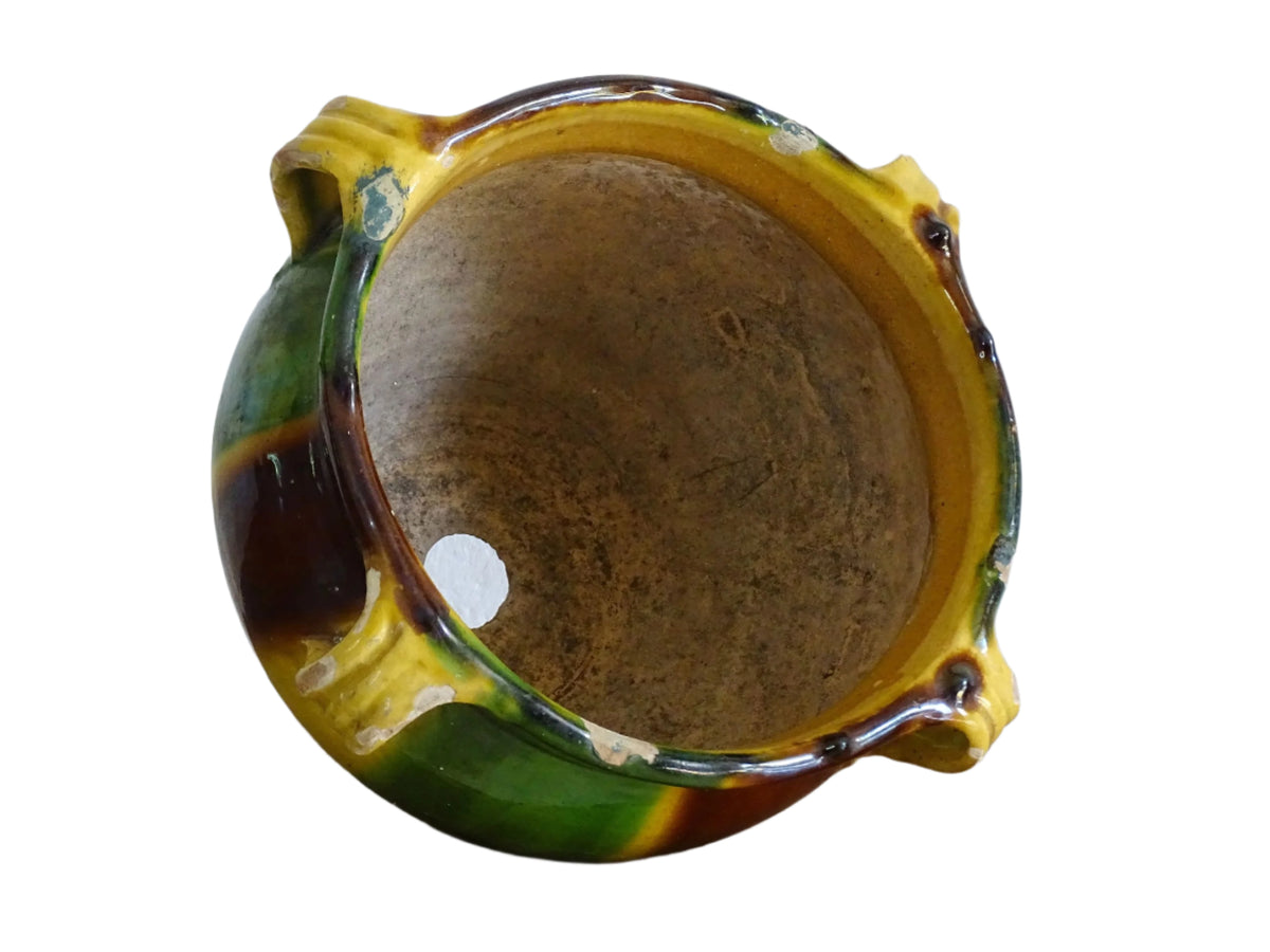 French antique ceramic planter from Castelnaudary. The pottery pot has a stripe drip glaze in yellow, green and brown. Antique cache pot in glazed terracotta.