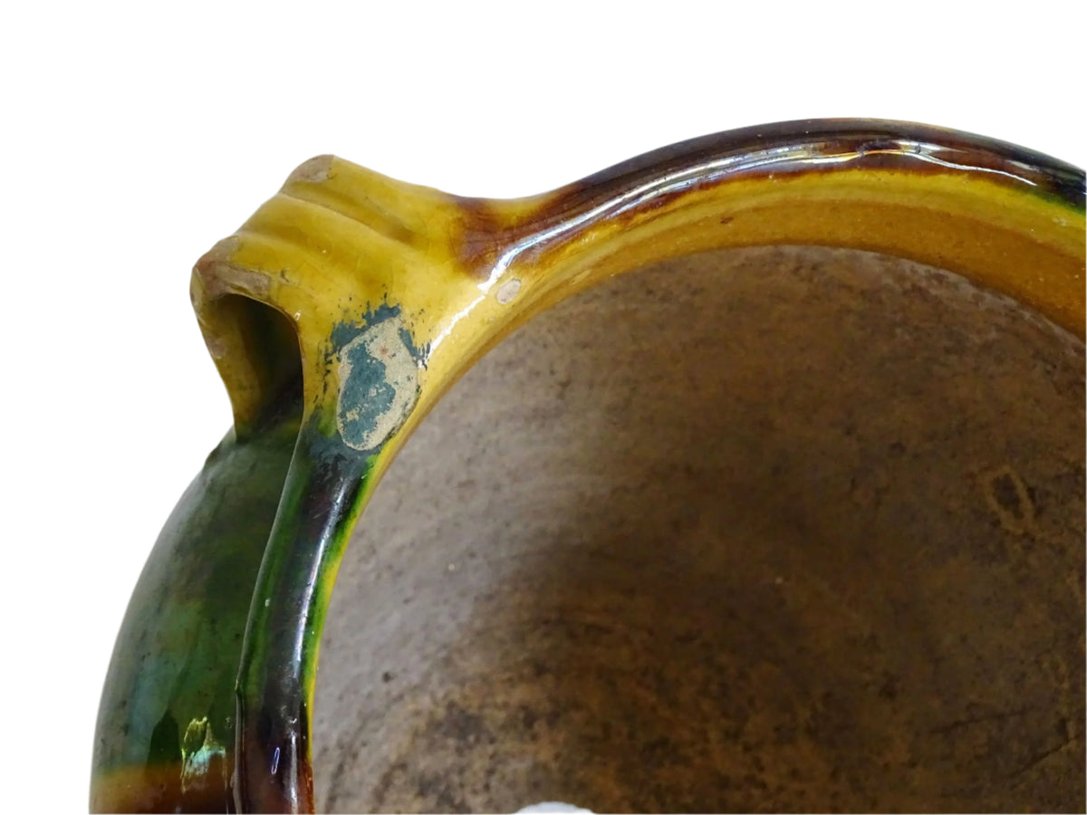 French antique ceramic planter from Castelnaudary. The pottery pot has a stripe drip glaze in yellow, green and brown. Antique cache pot in glazed terracotta.