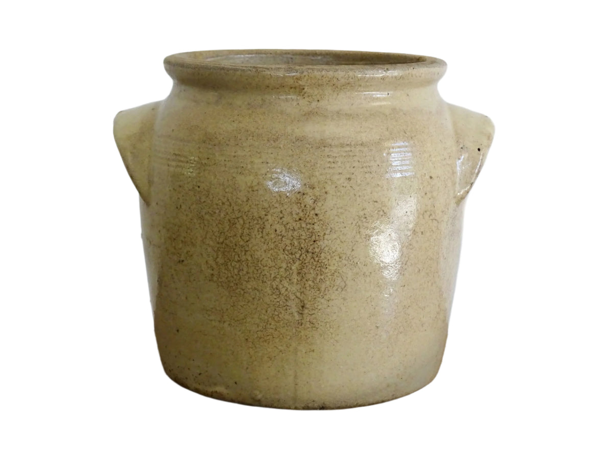 Rustic French antique stoneware confit jar. Glazed pottery cache pot is in a grey beige glaze for a French farmhouse style home.