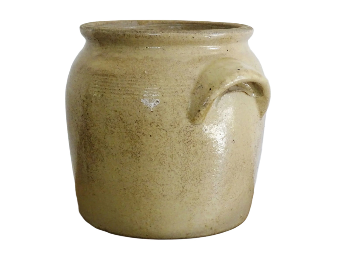 Rustic French antique stoneware confit jar. Glazed pottery cache pot is in a grey beige glaze for a French farmhouse style home.