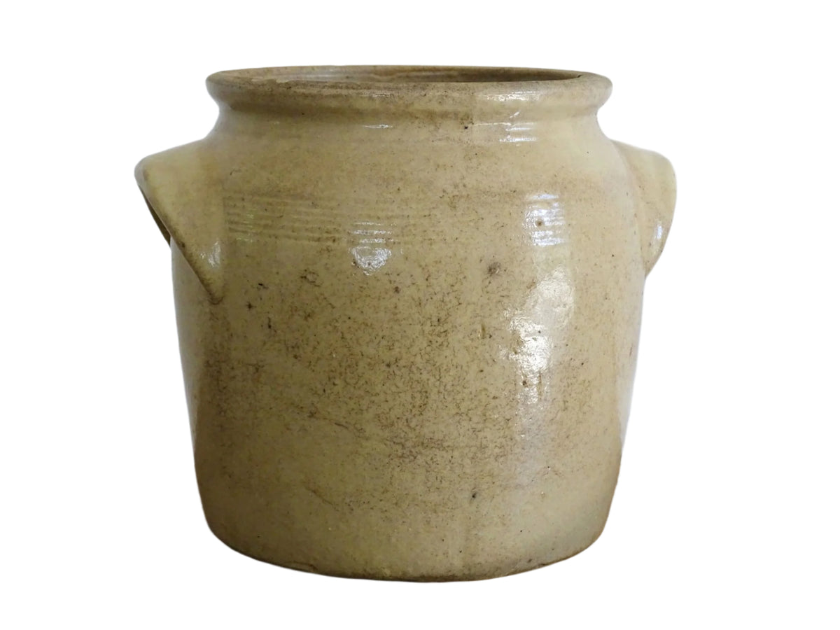 Rustic French antique stoneware confit jar. Glazed pottery cache pot is in a grey beige glaze for a French farmhouse style home.