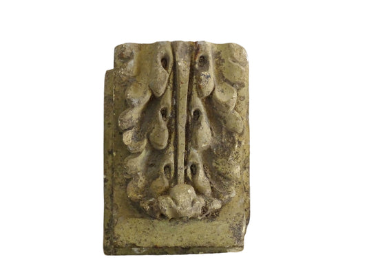French vintage corbel made from reconstituted stone with features classic acanthus leaf detailing. The carved design is bold and symmetrical, with layered, curling leaves and a central ridge. Often referred to as an architectural fragment or stone bracket for cornice or shelf.