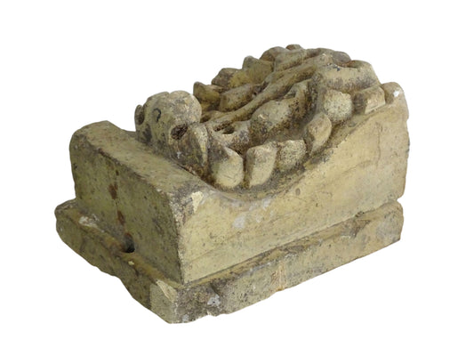 French vintage corbel made from reconstituted stone with features classic acanthus leaf detailing. The carved design is bold and symmetrical, with layered, curling leaves and a central ridge. Often referred to as an architectural fragment or stone bracket for cornice or shelf.