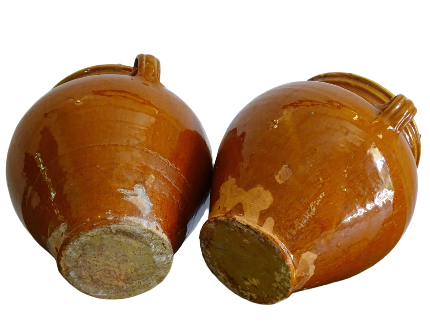 Pair of French antique confit pot vases with an orange glaze to the exterior and a yellow glaze to the interior for preserving food. Ceramic jars for rustic farmhouse decor. Orange and yellow glazed terracotta vases.