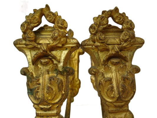 Pair of French antique curtain hooks with rose garlands Highly ornate, a garland of roses adorn the ends of these gilt bronze holdbacks, and scrolls decorate the bars.