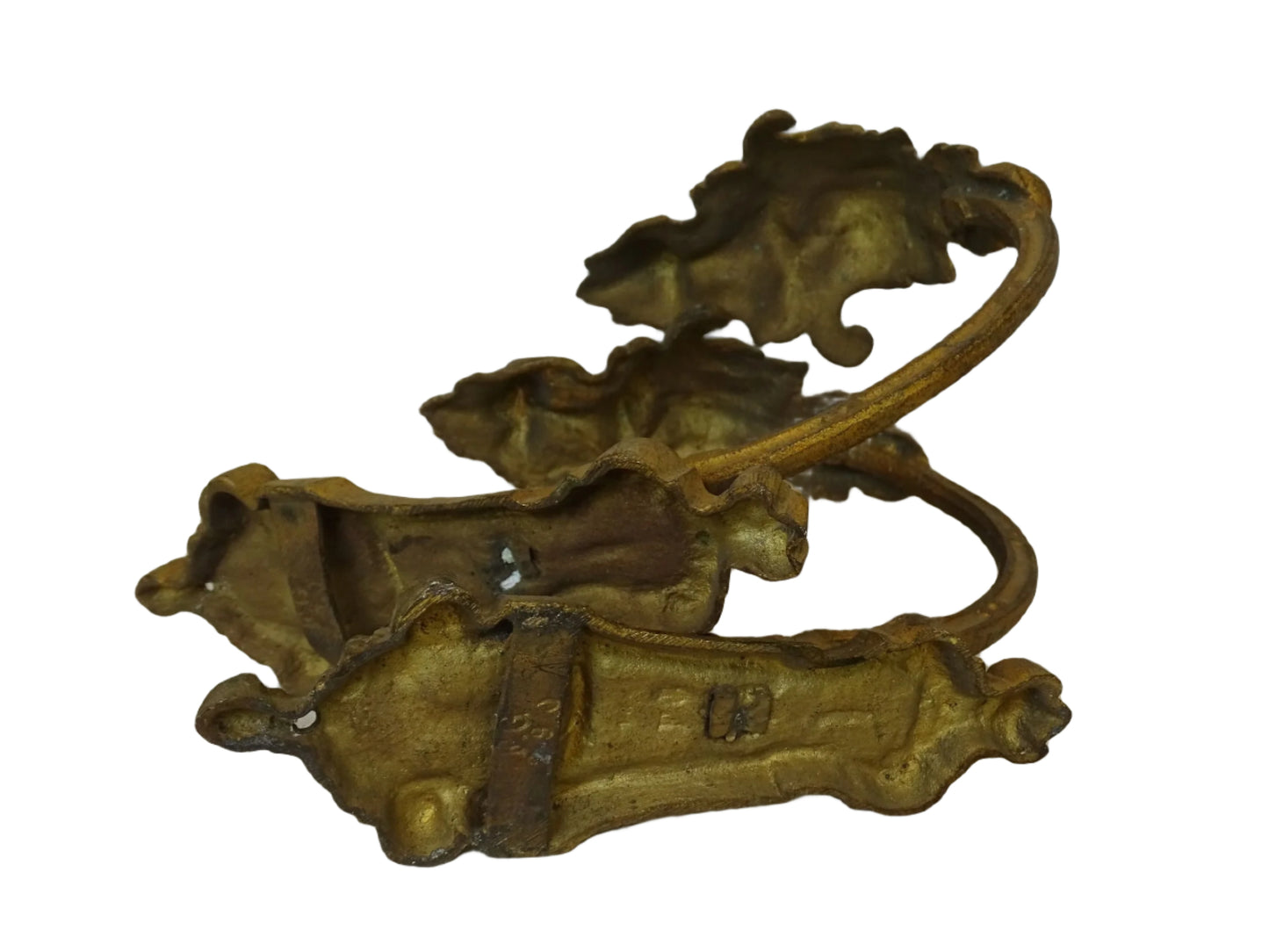 Pair of French antique curtain holdbacks in gilt bronze. These rococo style hooks are adorned with acanthus leaf motifs.