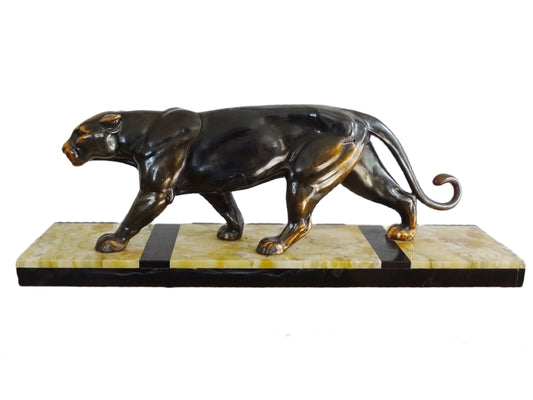 French Art Deco panther sculpture on a marble base. The black panther ornament has copper-painted highlights and is sculpted in a strong, prowling pose. It is mounted on a rectangular base of cream marble with black and white detailing.