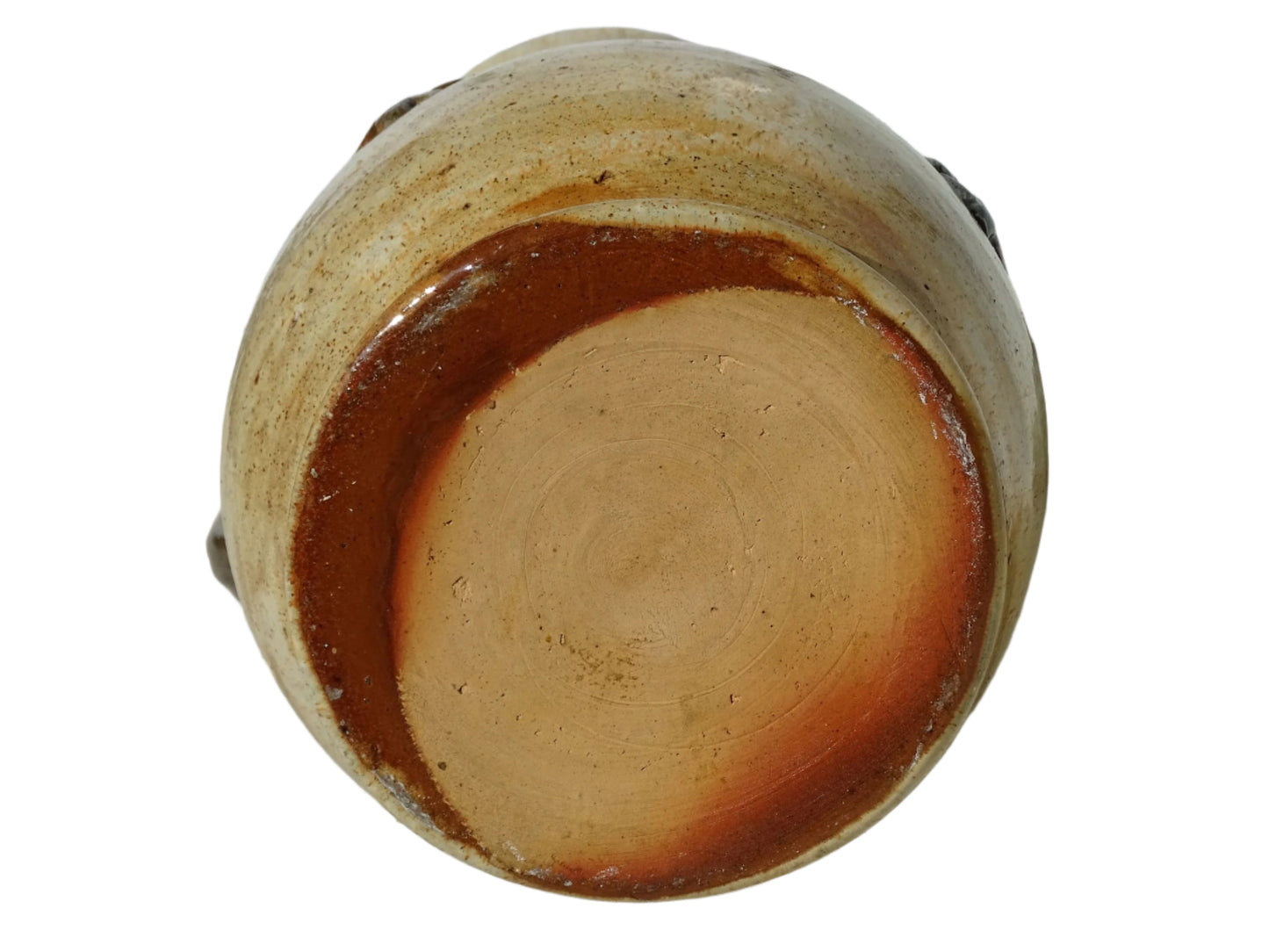 vintage pottery jug with fleur de lys motifs in the style of Roger Guerin. Tall pitcher is glazed in cream, with brown highlights. Display on a sideboard filled with flowers.