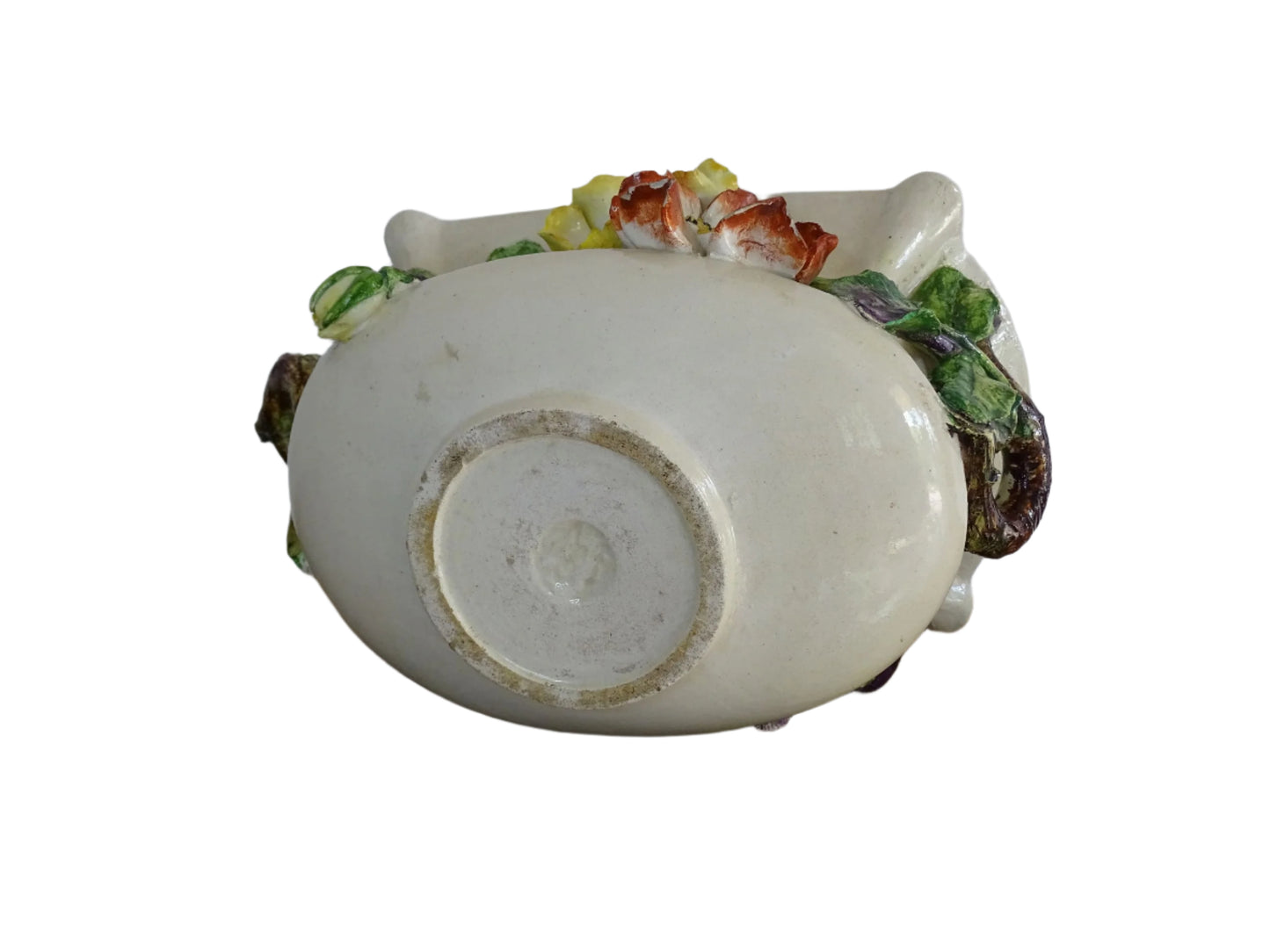 French antique barbotine ceramic planter from Monaco. One side is decorated with green leaves and purple flower buds, the other with red and yellow flowers. Highly decorative majolica pottery jardiniere.