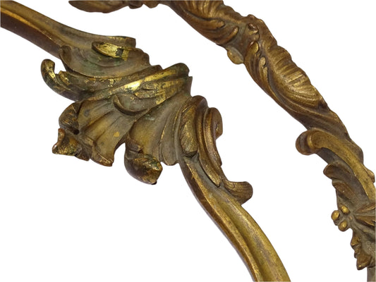 Decorative pair of antique French furniture pediments with a curved shape in gilt bronze. Detailed with classic scrollwork and acanthus leaf motifs.
