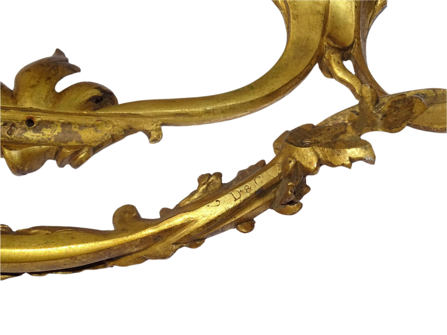 Decorative pair of antique French furniture pediments with a curved shape in gilt bronze. Detailed with classic scrollwork and acanthus leaf motifs.