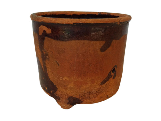 Rustic French antique terracotta sieve or faisselle. Earthenware cheese strainer with three feet.