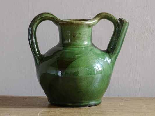 French green ceramic jug or orjol with handle and spout.