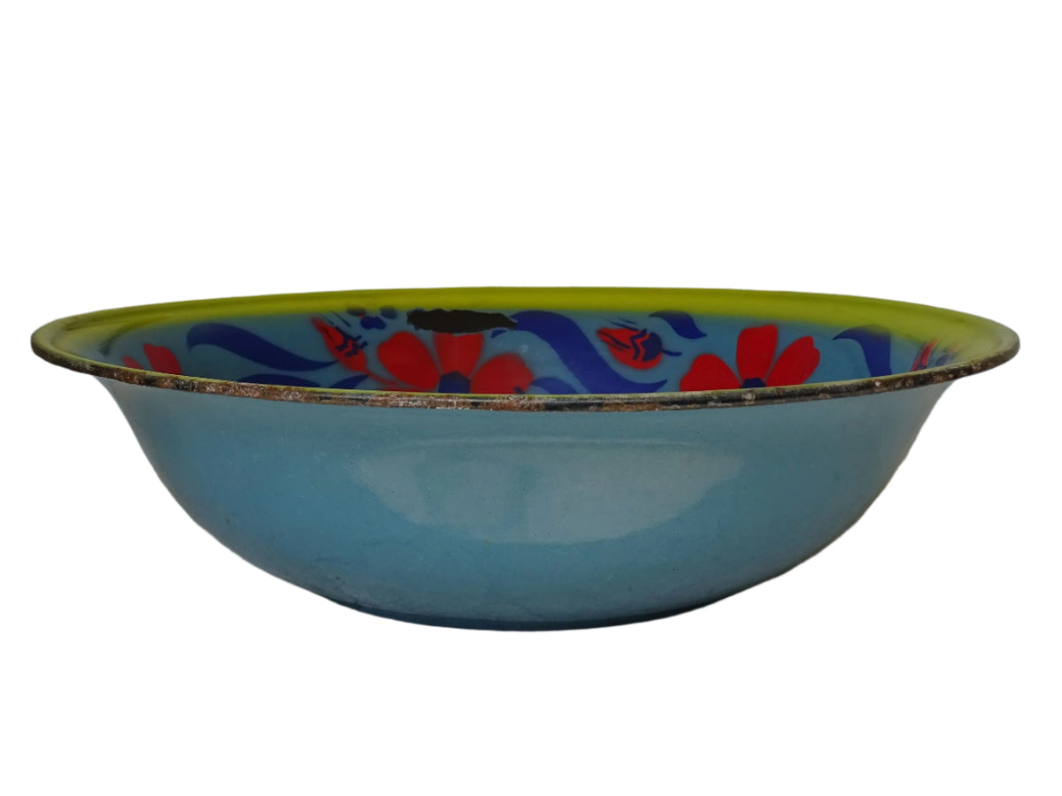 French vintage enamelled bowl with blue background, red flowers and a yellow trim.