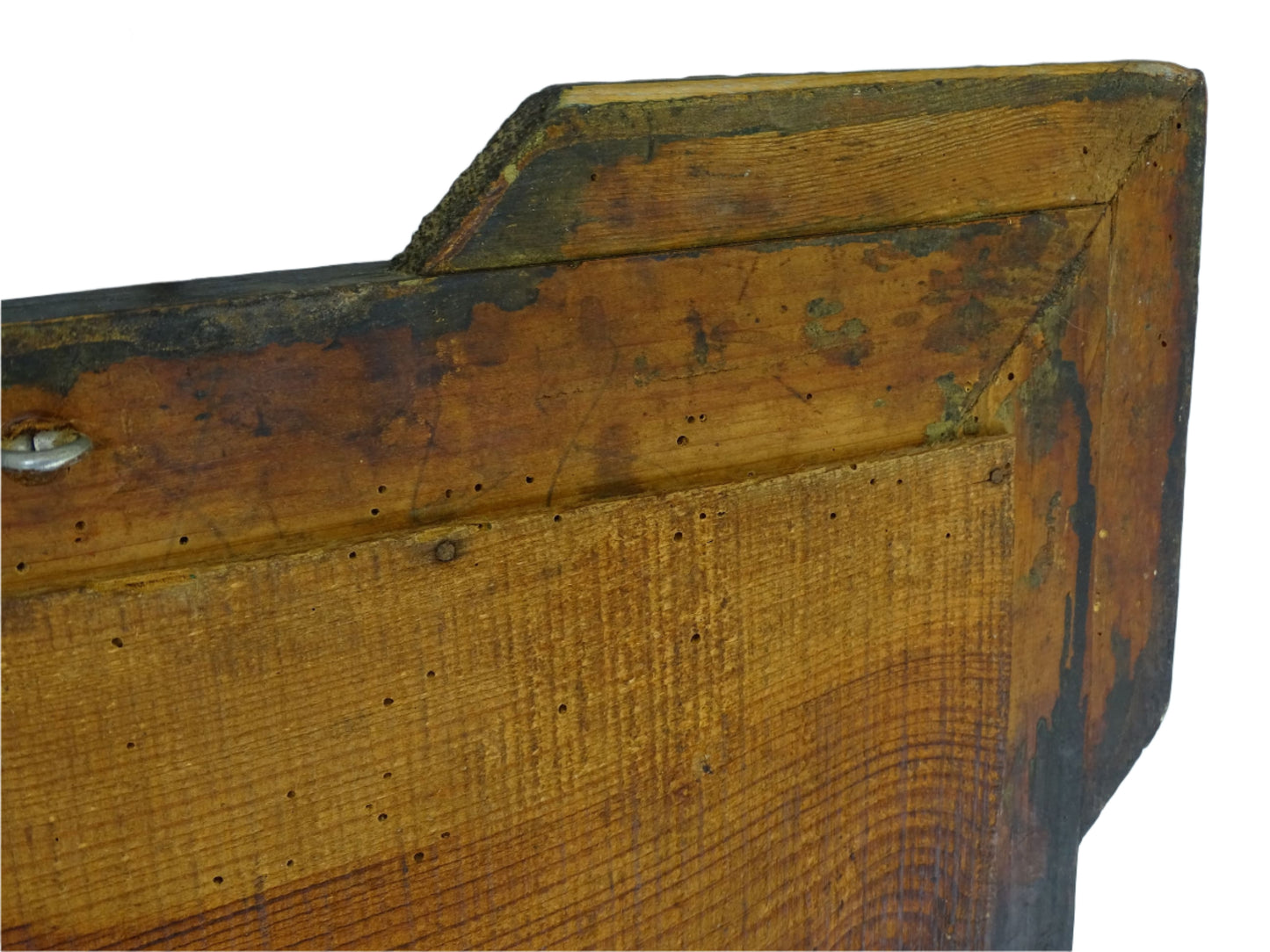 Aged antique French mirror from the Napoleon III period, featuring a frame with stepped corners and finely detailed gesso decoration. The giltwood frame showcases a repeating pattern of oval medallions, floral motifs, and textured cross-hatching.
19th century antique French mirror retains its original mercury glass plate, which shows natural signs of age including foxing and silver loss. The initials "M.J" are on the glass.