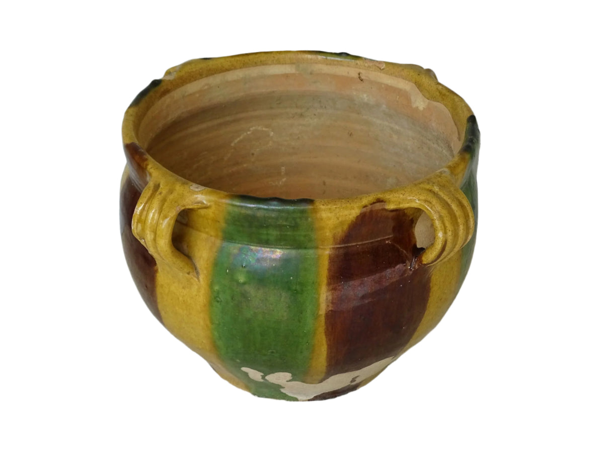 French antique terracotta planter from Castelnaudary. 19th century jardinière with a stripe drip glaze in yellow, green and brown. Antique earthenware pot with four loop handles.