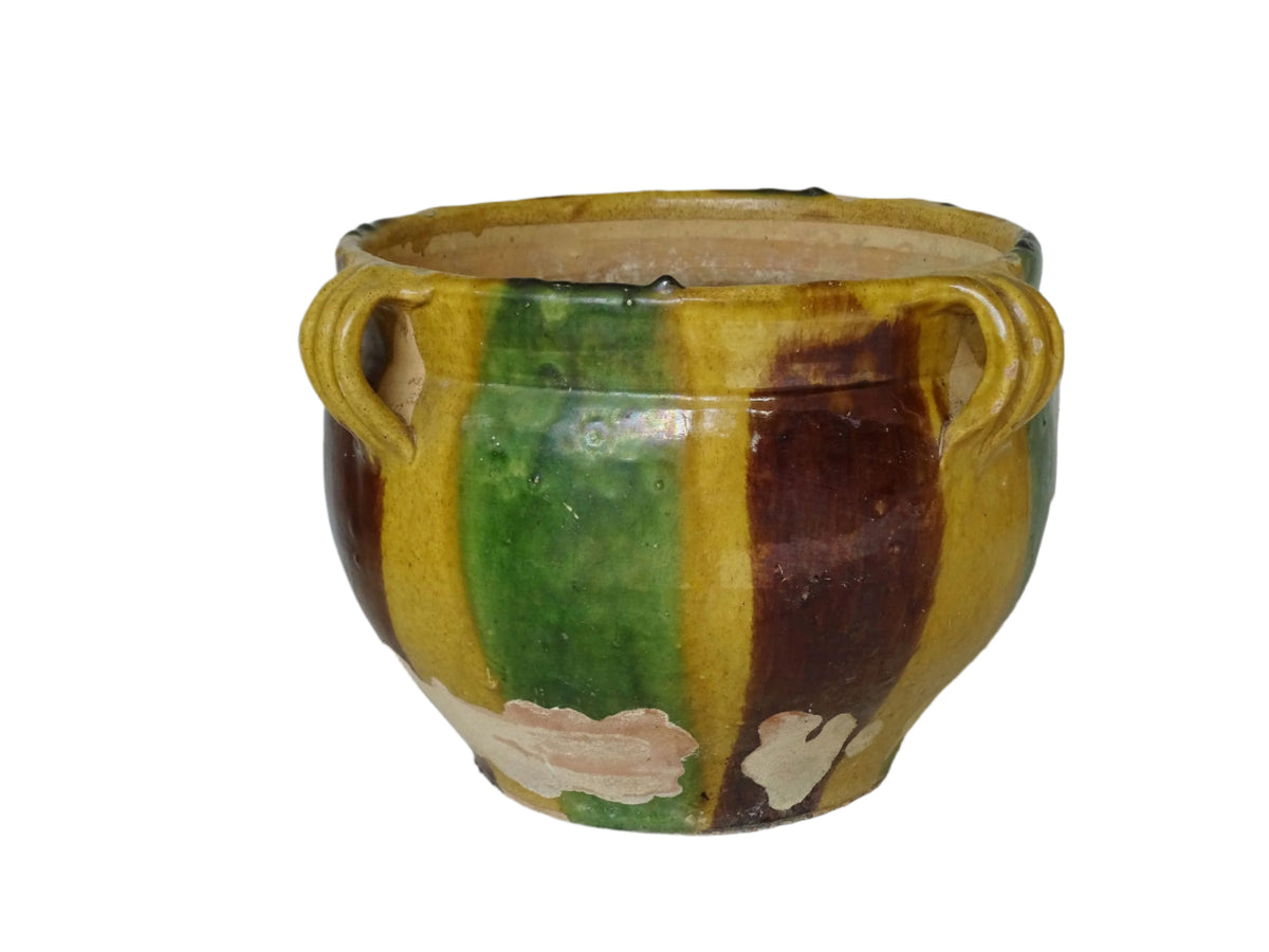 French antique terracotta planter from Castelnaudary. 19th century jardinière with a stripe drip glaze in yellow, green and brown. Antique earthenware pot with four loop handles.
