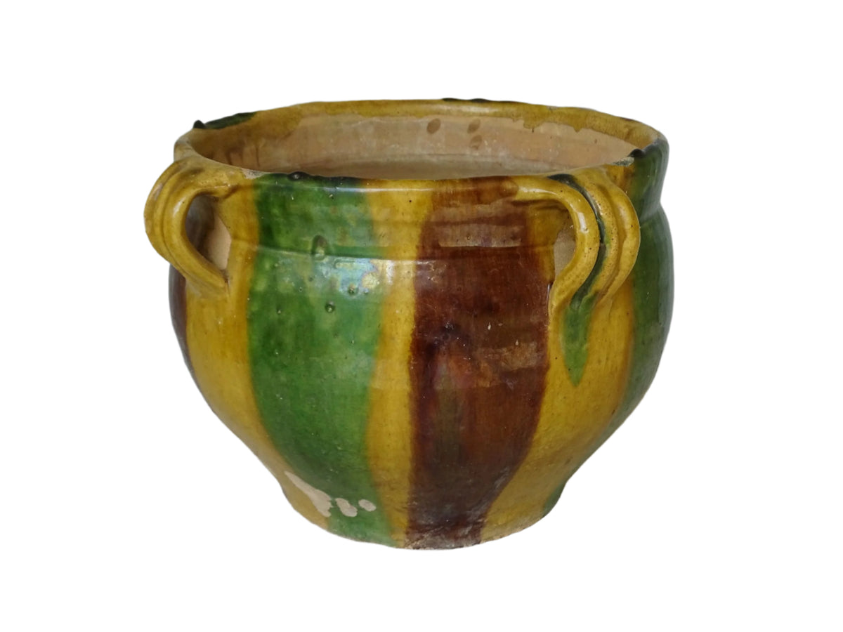 French antique terracotta planter from Castelnaudary. 19th century jardinière with a stripe drip glaze in yellow, green and brown. Antique earthenware pot with four loop handles.