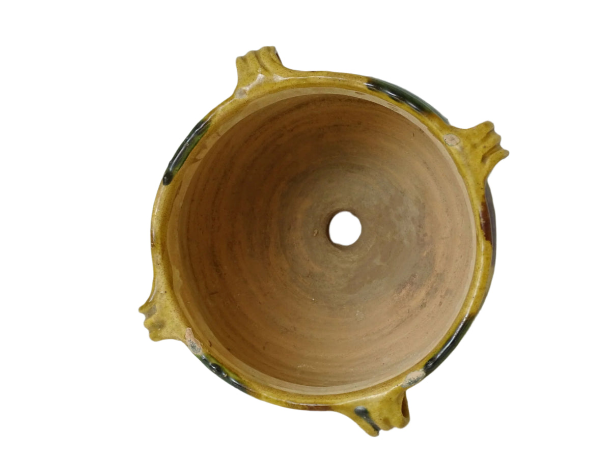 French antique terracotta planter from Castelnaudary. 19th century jardinière with a stripe drip glaze in yellow, green and brown. Antique earthenware pot with four loop handles.