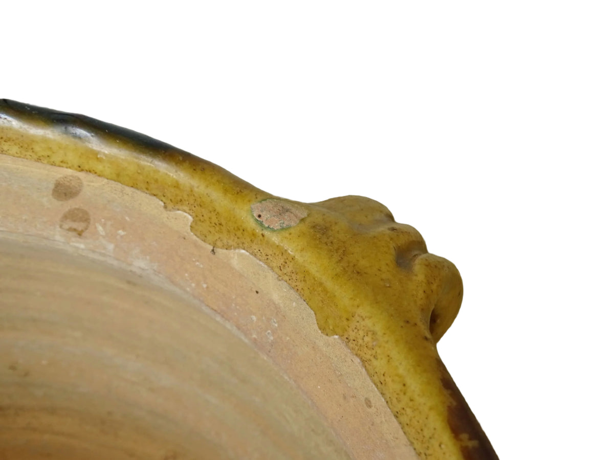 French antique terracotta planter from Castelnaudary. 19th century jardinière with a stripe drip glaze in yellow, green and brown. Antique earthenware pot with four loop handles.