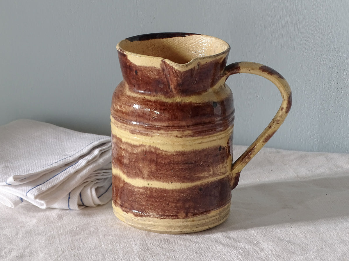 french antique ceramic jug with brown and yellow glaze
