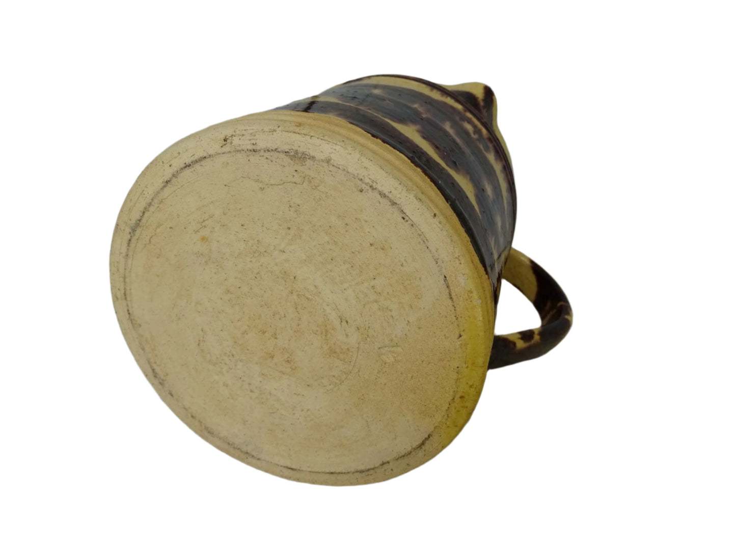 Rustic French antique ceramic pitcher with yellow glaze and brown drip glaze detailing. This Dieulefit pottery jug has a handle to the side.
