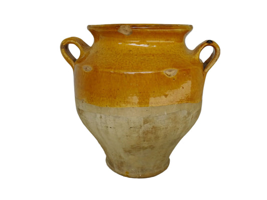 Antique French confit pot with yellow glaze. The terracotta has a rich patina and mustard yellow glaze is beautifully warm. The confit jar has two handles and tapers towards the bottom.