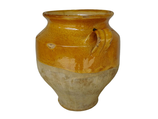 Antique French confit pot with yellow glaze. The terracotta has a rich patina and mustard yellow glaze is beautifully warm. The confit jar has two handles and tapers towards the bottom.