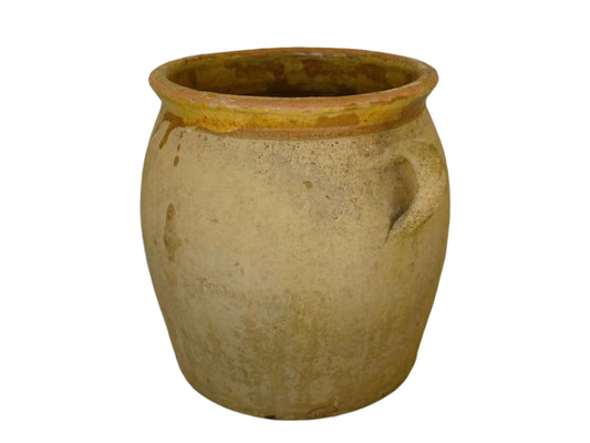 French antique confit pot with a yellow glazed interior and unglazed terracotta exterior.