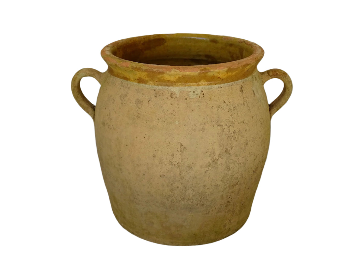French antique confit pot with a yellow glazed interior and unglazed terracotta exterior.