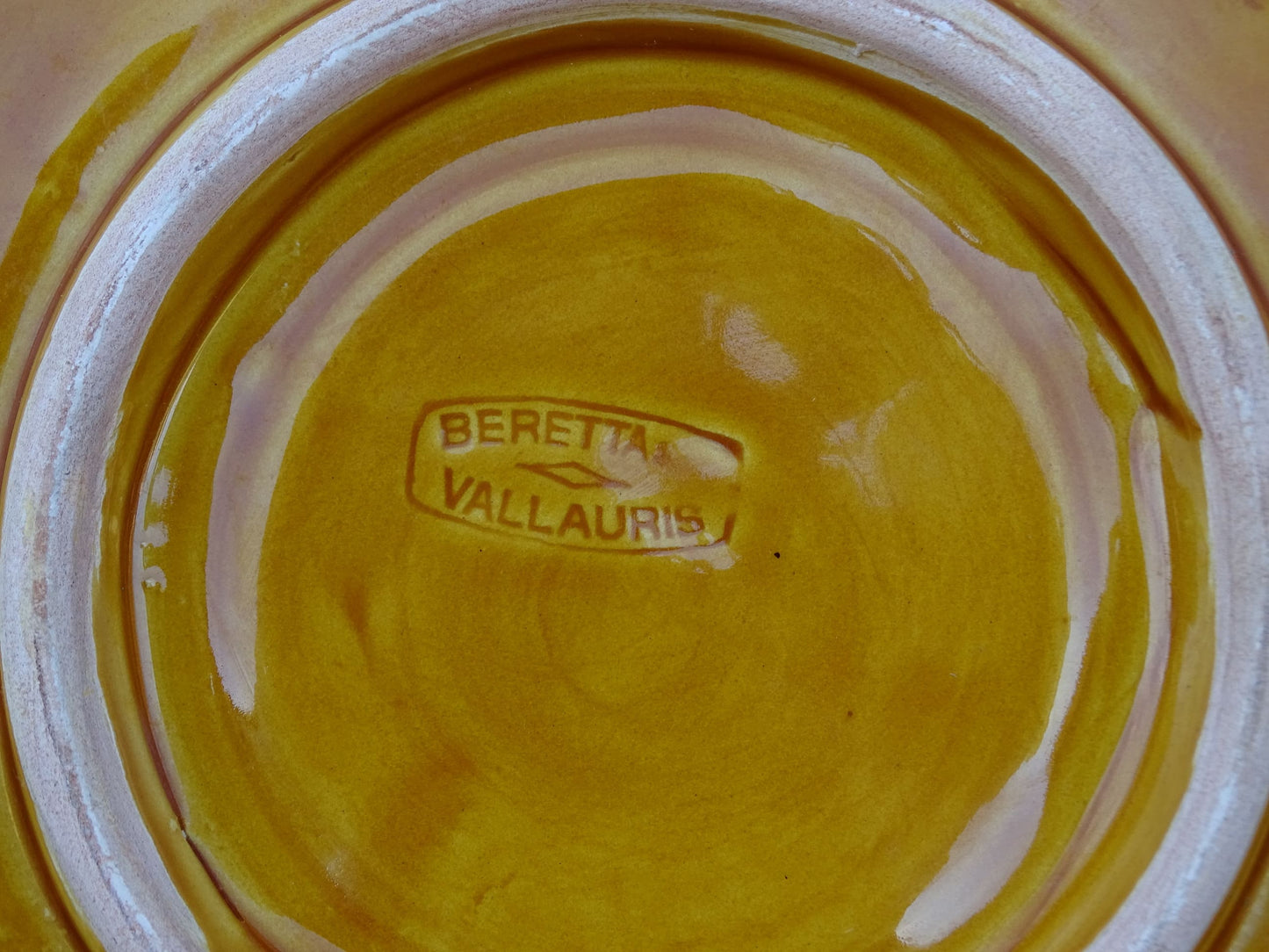 French vintage Vallauris plate with yellow glaze.