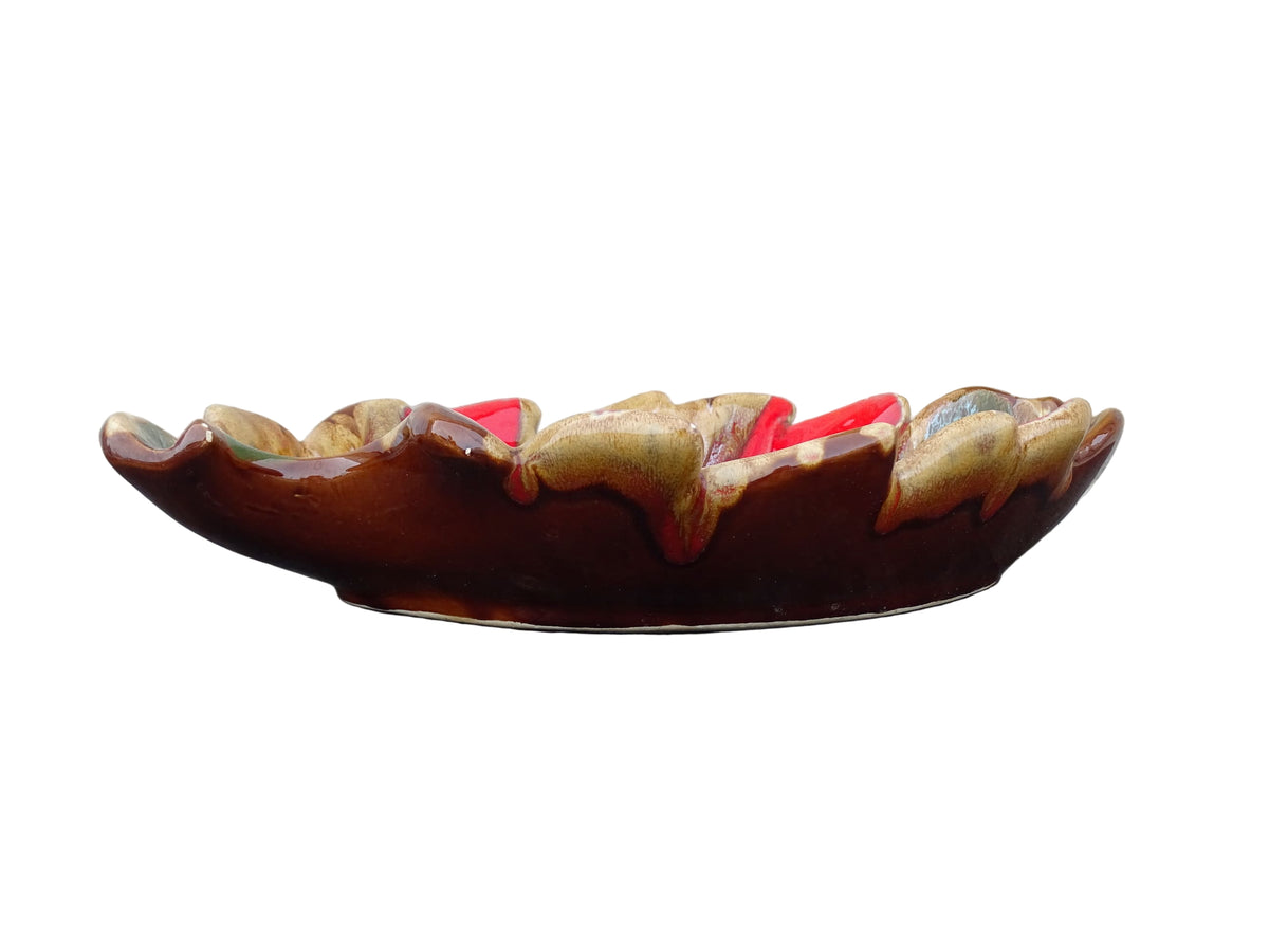 French vintage Vallauris ceramic bowl in a leaf design and glazed in brown and red with details in green, yellow and white.