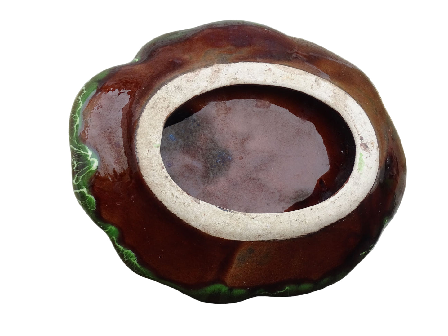 French vintage Vallauris pottery dish with a bright green glaze. To the centre, is an abstract glaze design in brown with hints of white.