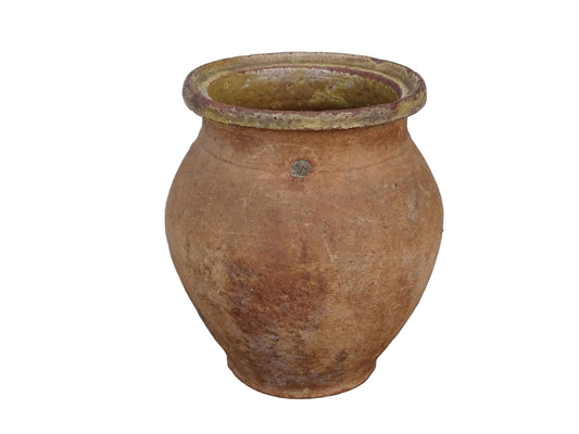 French antique terracotta jug with yellow glaze interior, rustic earthenware pitcher.