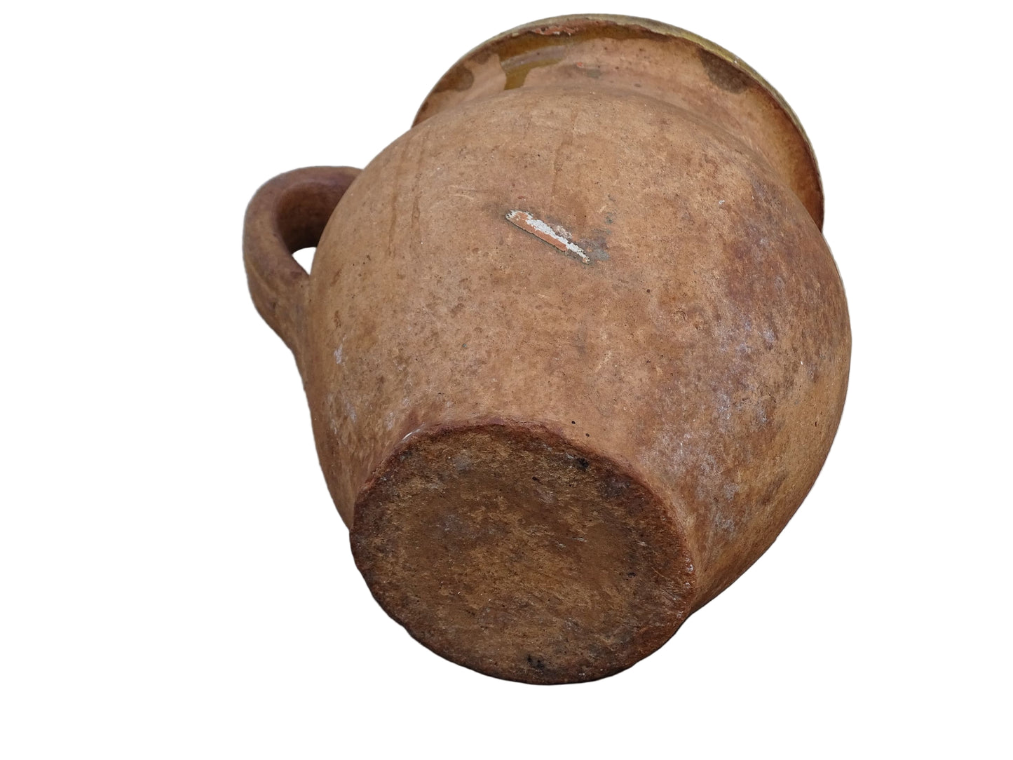 French antique terracotta jug with yellow glaze interior, rustic earthenware pitcher.