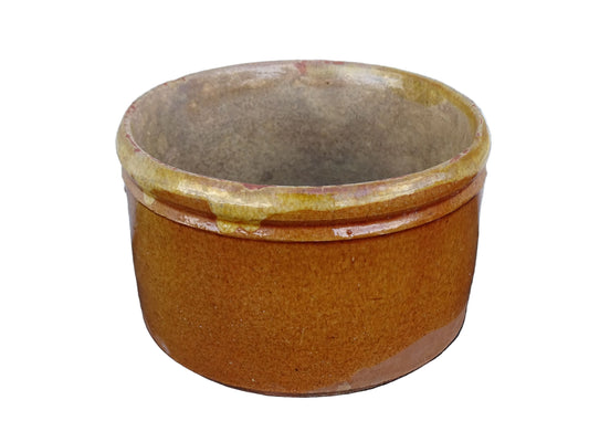 French antique earthenware pot with yellow glaze and timeworn interior.