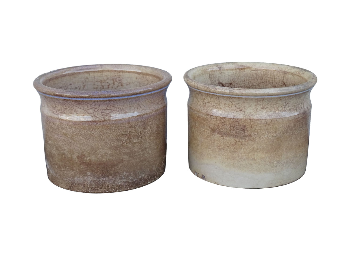 Timeworn French antique ceramic pots by Sarreguemines. 19th century rustic pottery confiture pots for a French country farmhouse display.