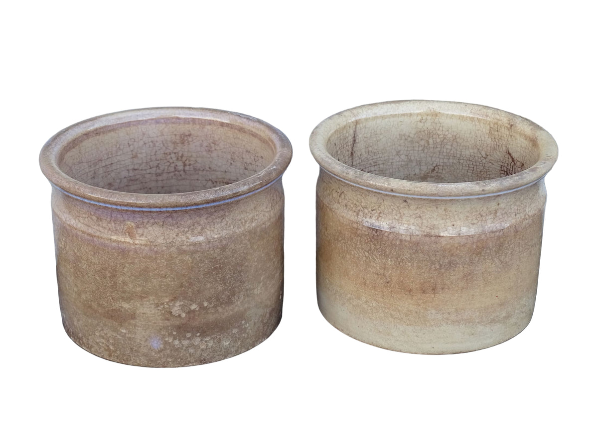Timeworn French antique ceramic pots by Sarreguemines. 19th century rustic pottery confiture pots for a French country farmhouse display.