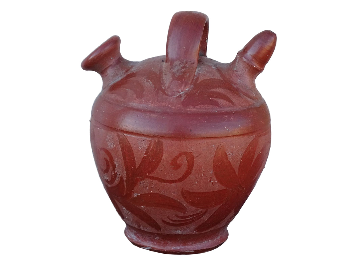 French vintage pottery gargoulette in red with floral detailing. Ceramic jug with handle and two spouts.
