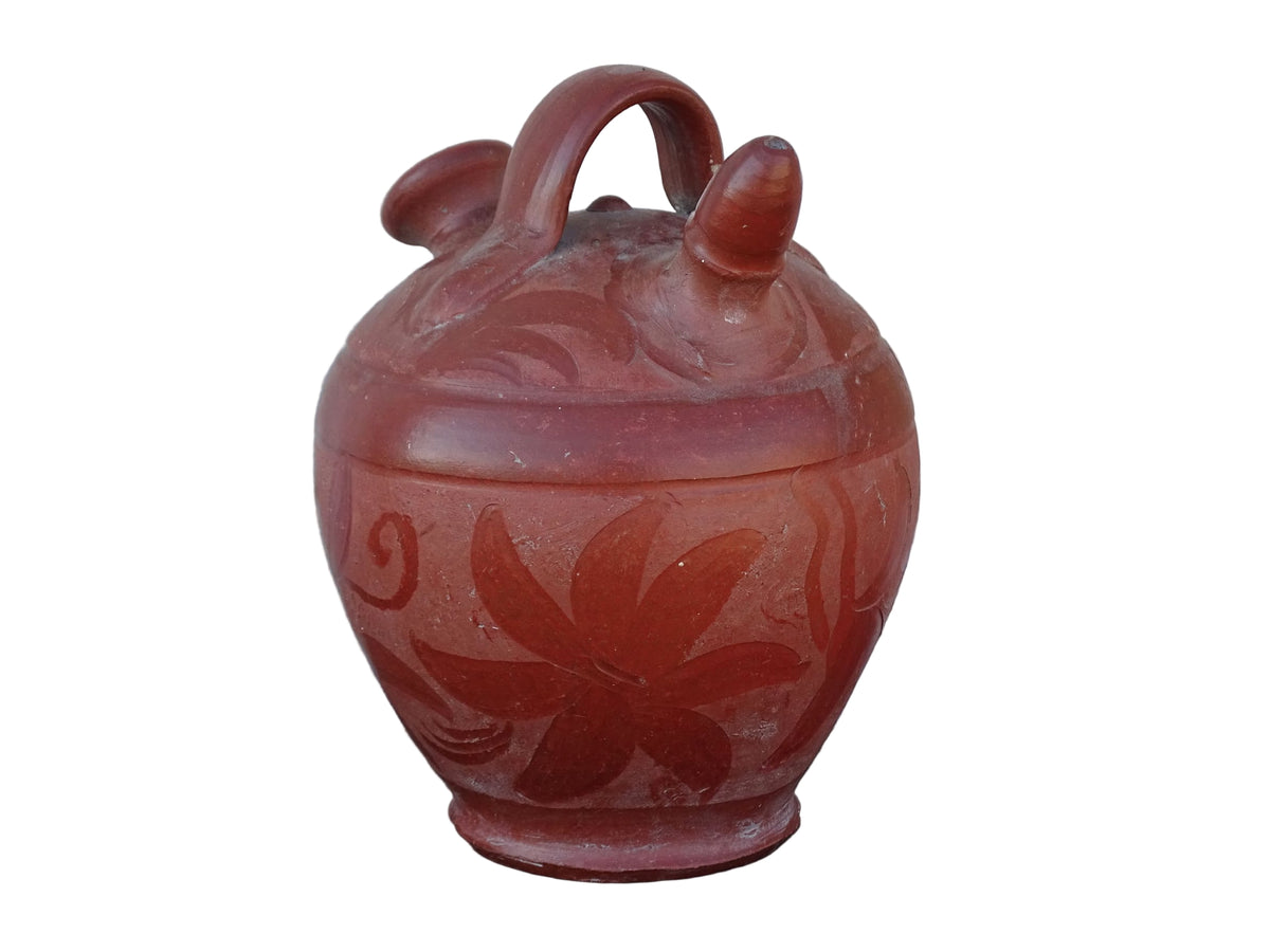 French vintage pottery gargoulette in red with floral detailing. Ceramic jug with handle and two spouts.