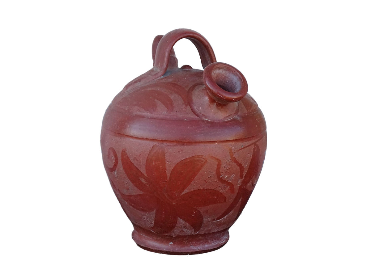 French vintage pottery gargoulette in red with floral detailing. Ceramic jug with handle and two spouts.