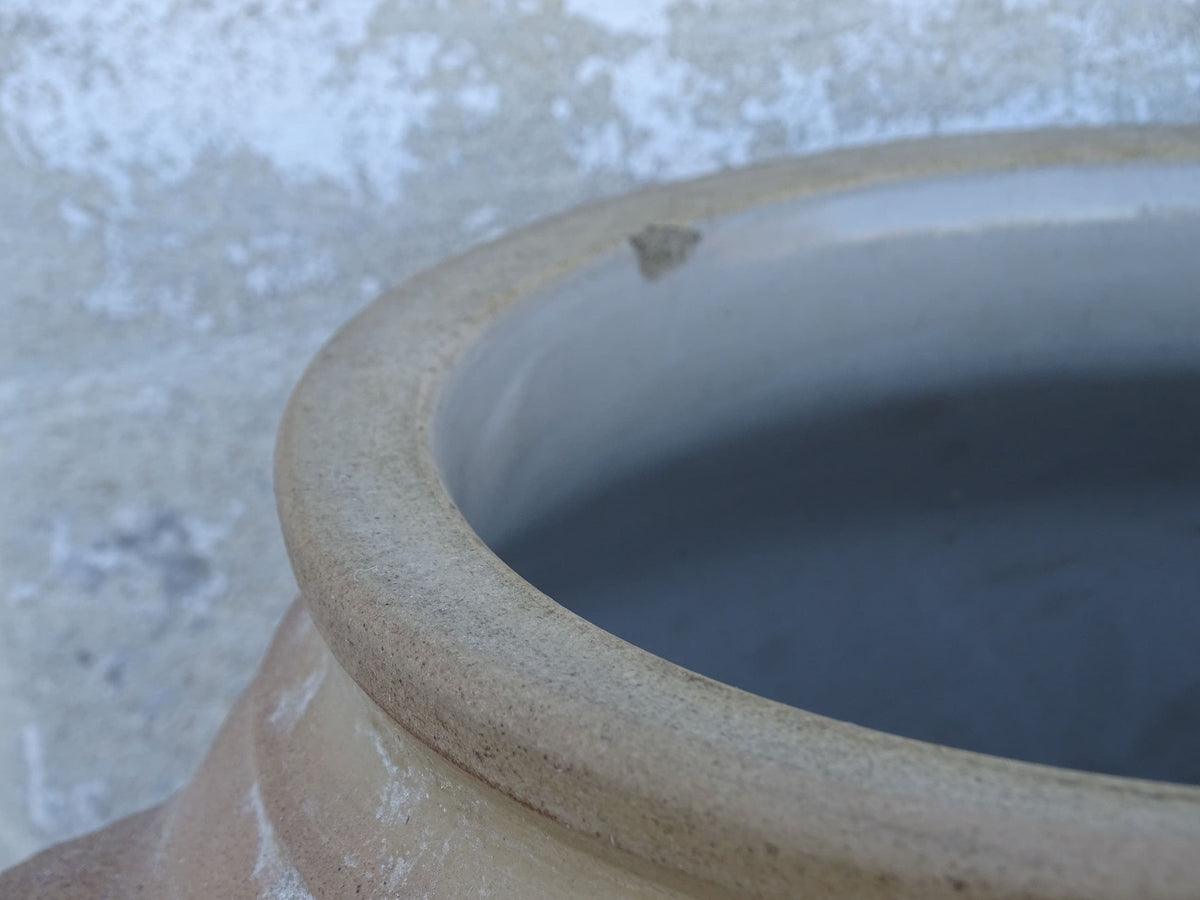 Large French antique stoneware jar with a brown glaze. This old confit pot has two handles.