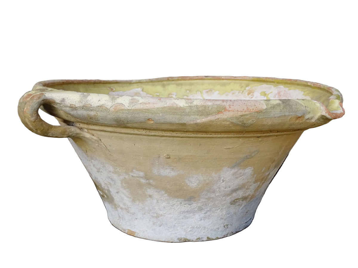 French antique tian bowl with a yellow glazed interior. Old terracotta confit bowl from the 19th century.