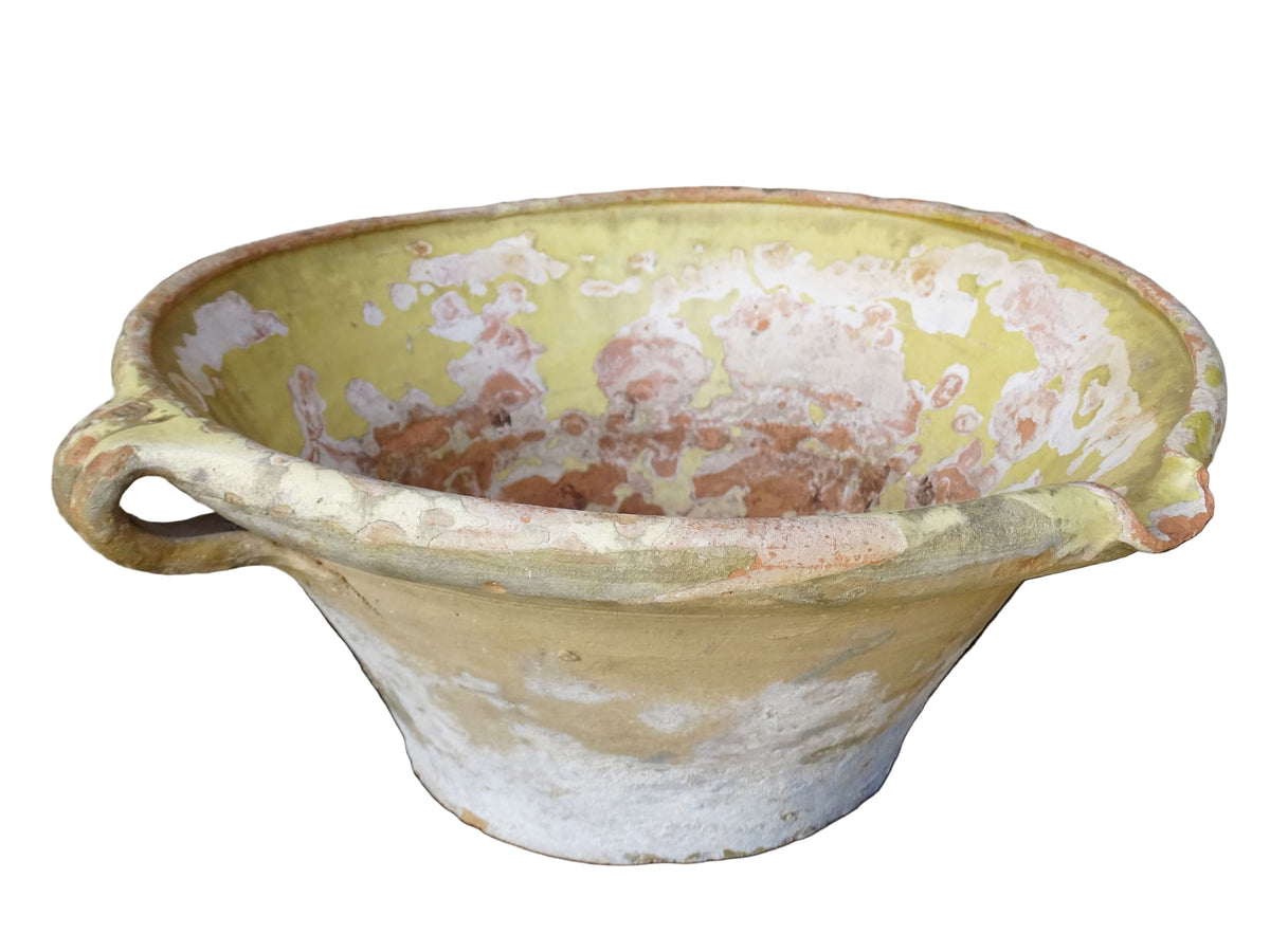 French antique tian bowl with a yellow glazed interior. Old terracotta confit bowl from the 19th century.