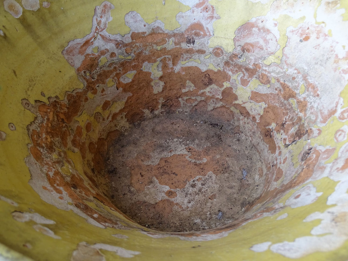 French antique tian bowl with a yellow glazed interior. Old terracotta confit bowl from the 19th century.